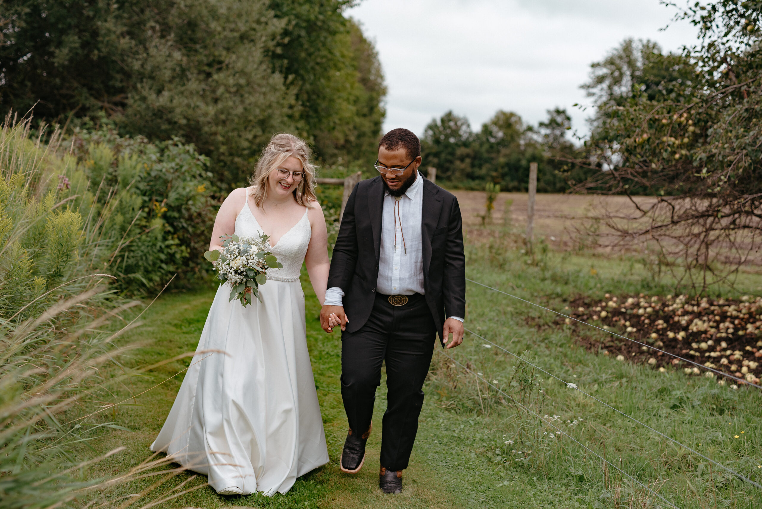 Rustic backyard tent wedding in Kitchener, Ontario with a cute care-free couple!